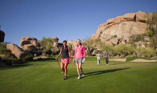 Two women walking on Boulder's golf course