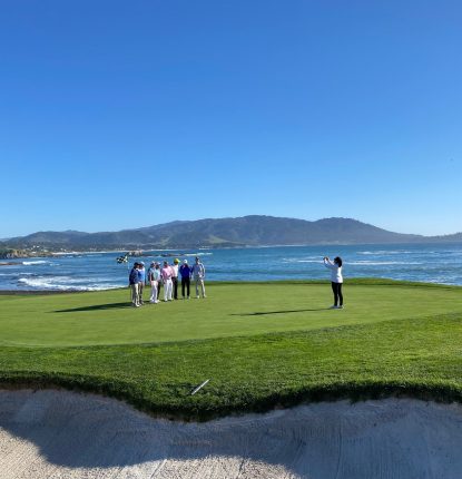 Pebble Beach 18th Green with Players taking a picture