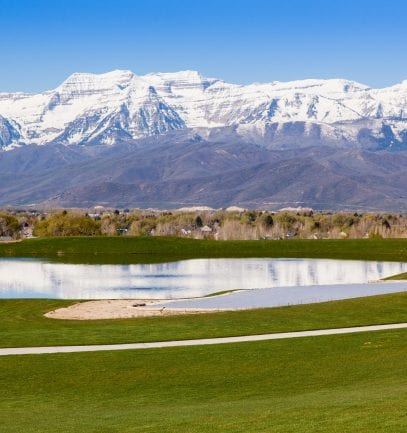 Red Ledges golf course with snow capped mountains in the background
